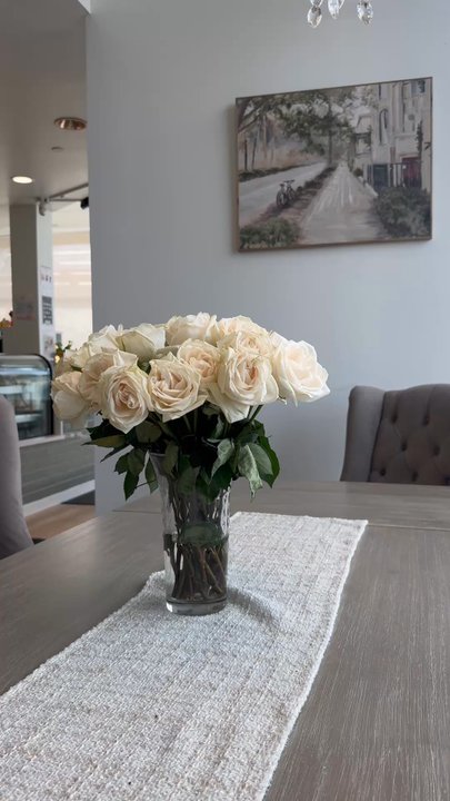 Cozy Coffee - Cozy family style table with fresh flowers and chandelier - Coffee & Tea Near Me - Westminster, Colorado