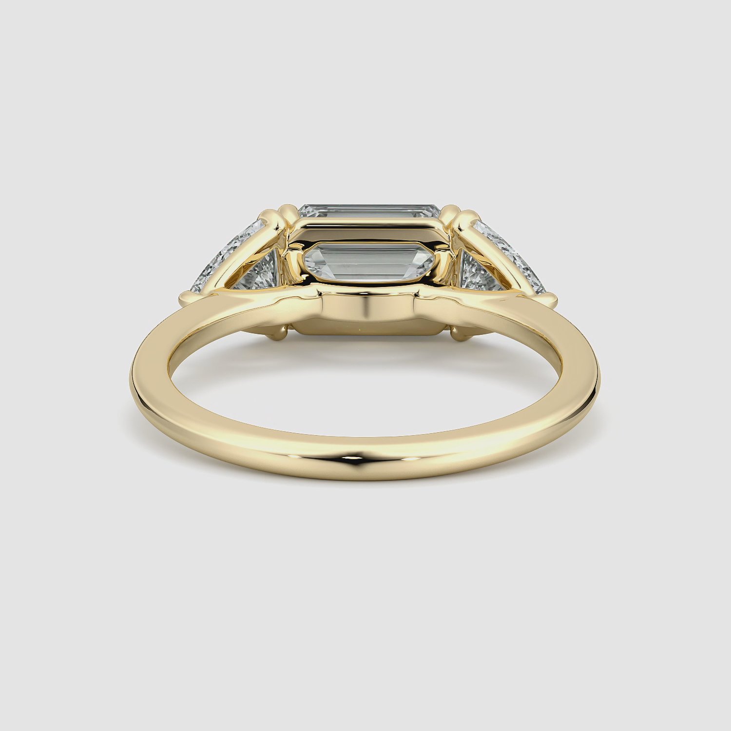 The Three Stone | Emerald | 18k | Yellow Gold | bandAccent: Plain | diamondOrientation: horizontal | sideStoneCarat: 0.50ct | sideStoneShape: Trillion | caratWeight: other