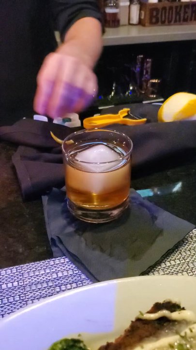 The Blue Ox - Flamed orange for the bacon and legs cocktail. - New American Near Me - Lynn, Massachusetts