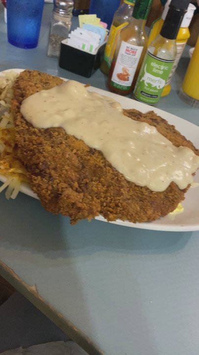 Sherrie's Place - This chicken fried steak can serve 3! Comes w eggs and hash browns. Oh momma! - American Near Me - Casper, Wyoming