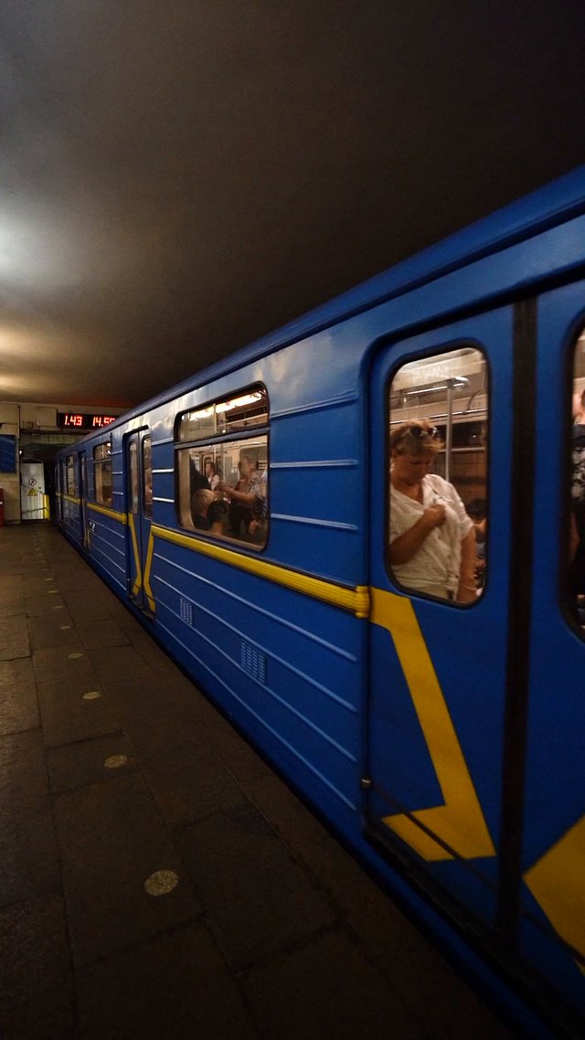 Blue subway departing 