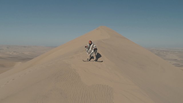 Sandboarding in desert