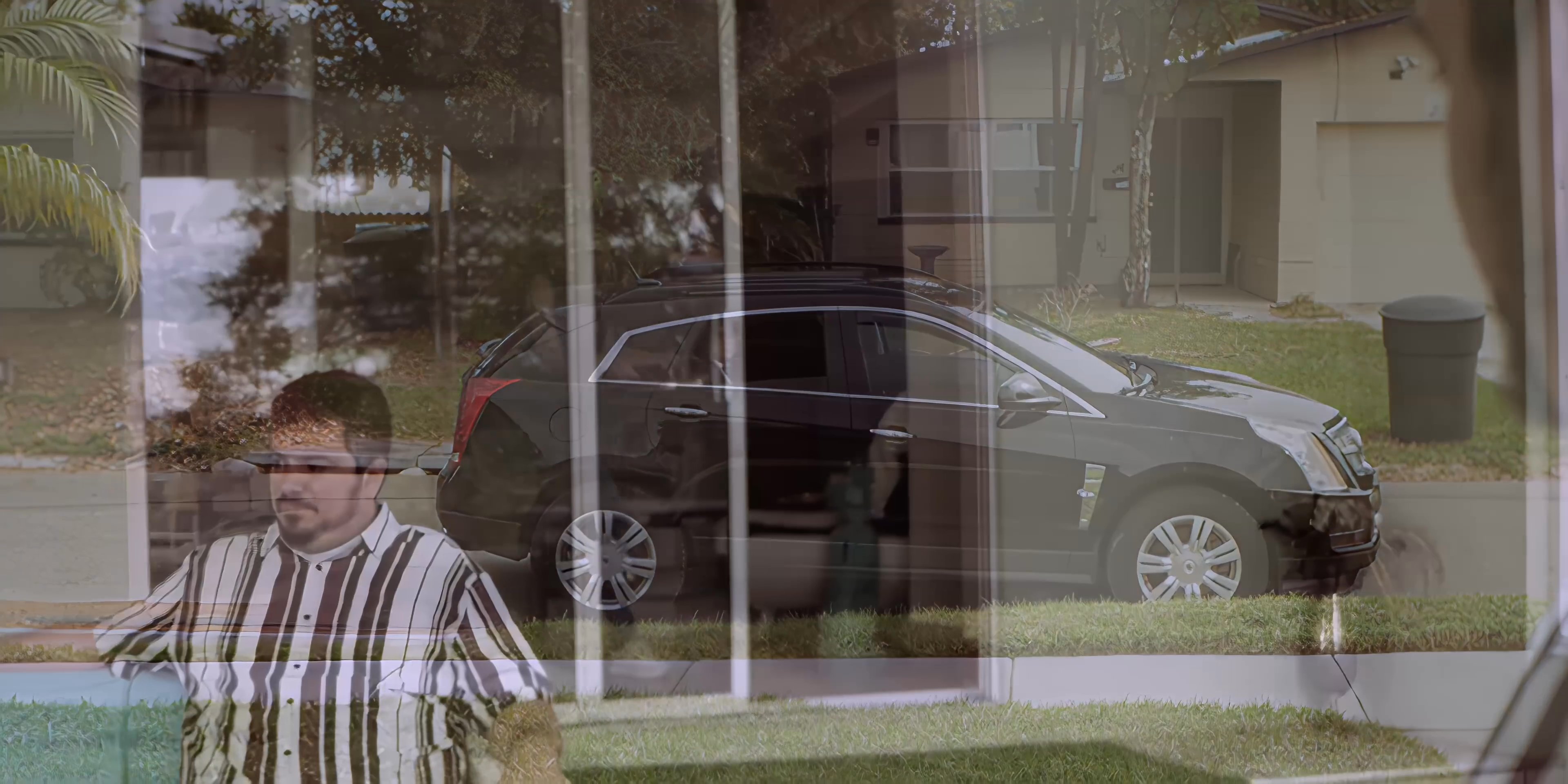 An individual welcomes guests at their residence before transitioning to an outdoor patio setting where a woman serves refreshments to seated attendees.
