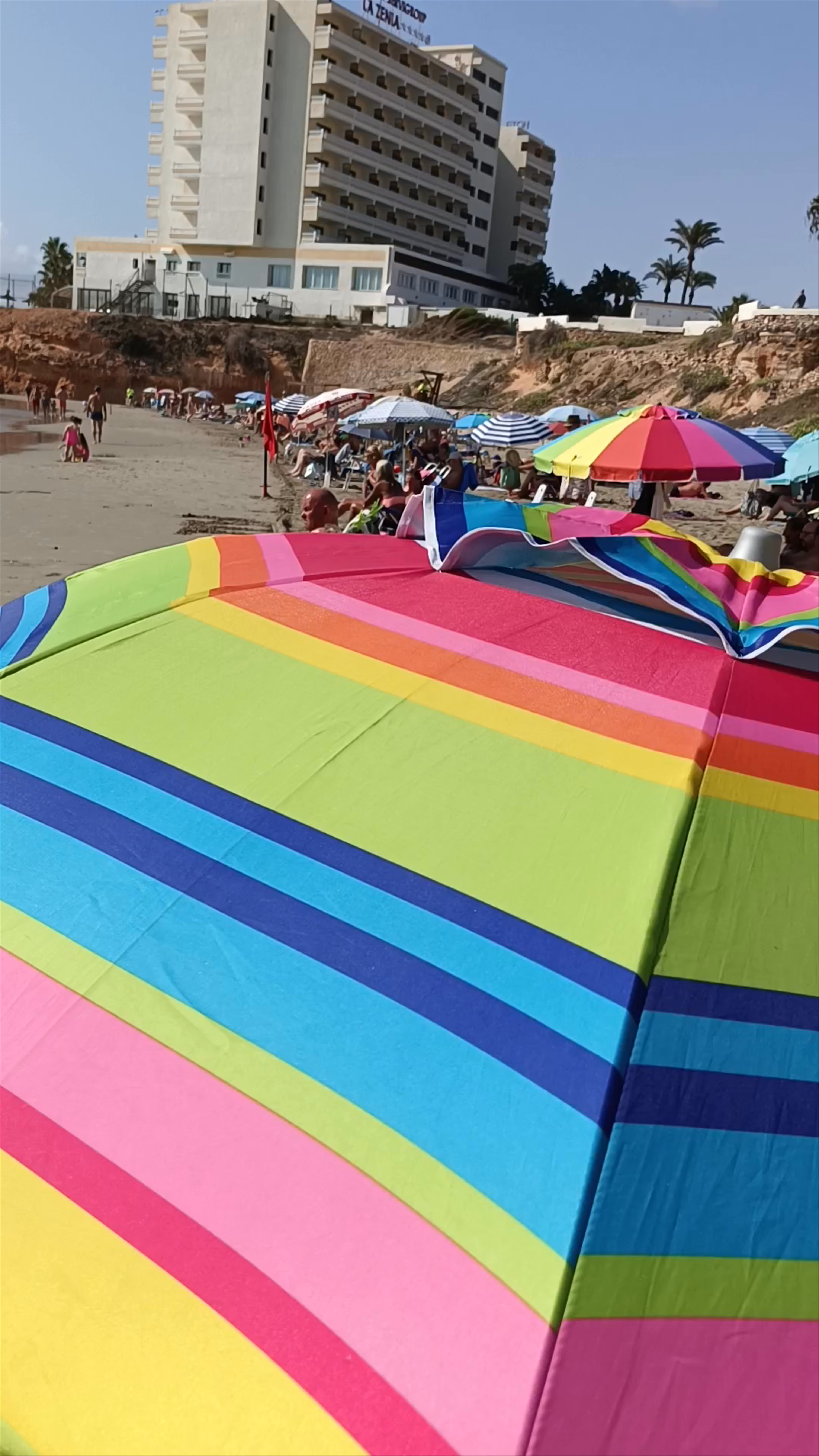 Vibrant Beach Life at Playa Cala Cerrada, Orihuela