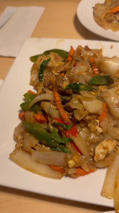 Simply Thai - This is the Drunken Noodle and Sweet Sausage Fried Rice. These dishes were devoured, leaving nothing left on the plate!! - Thai Near Me - Kingston, Rhode Island