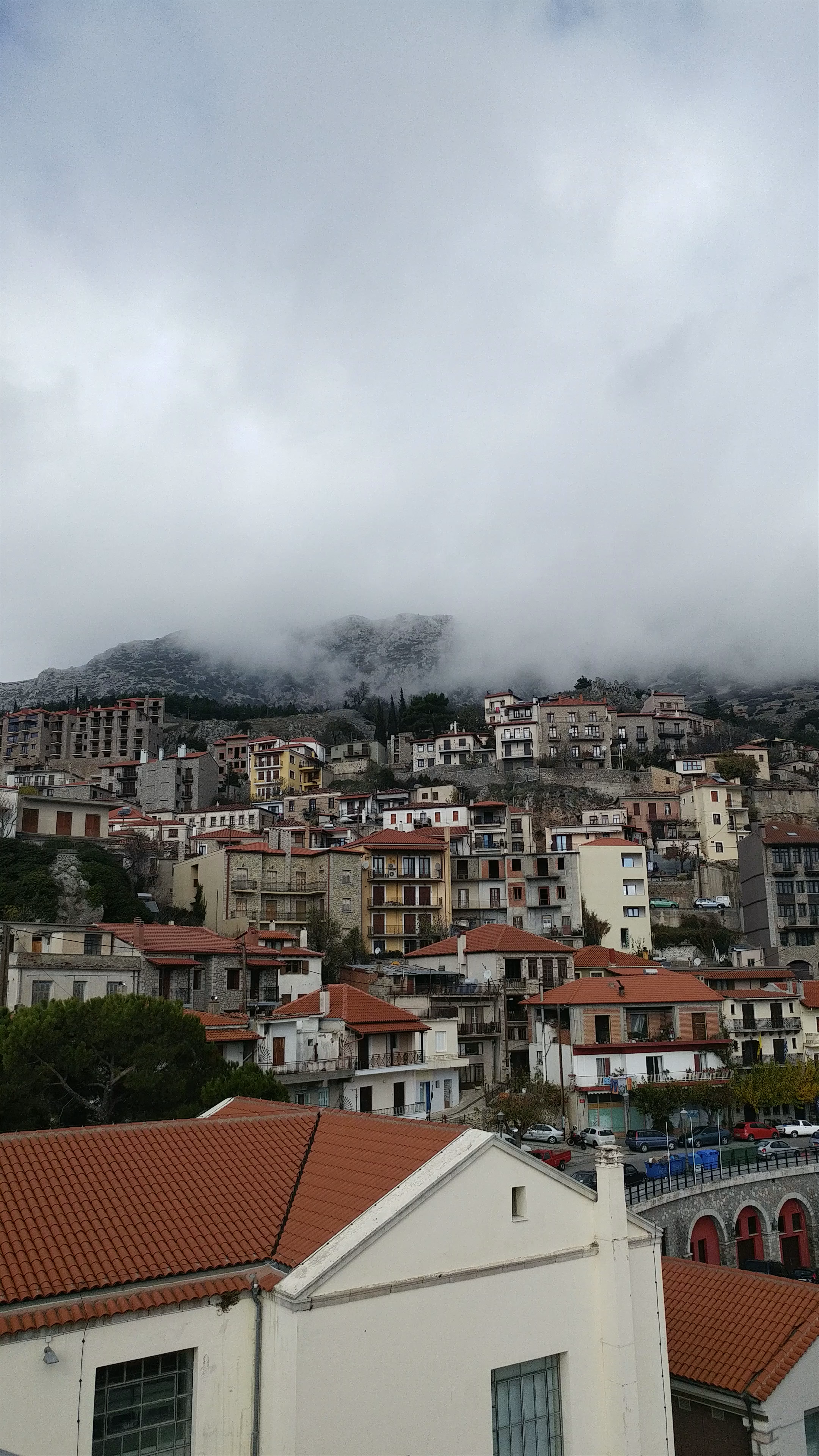 Clock Tower of Arachova: Misty Mountain Village Views in Boeotia, Greece