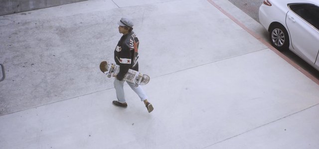 Man walking with a skateboard