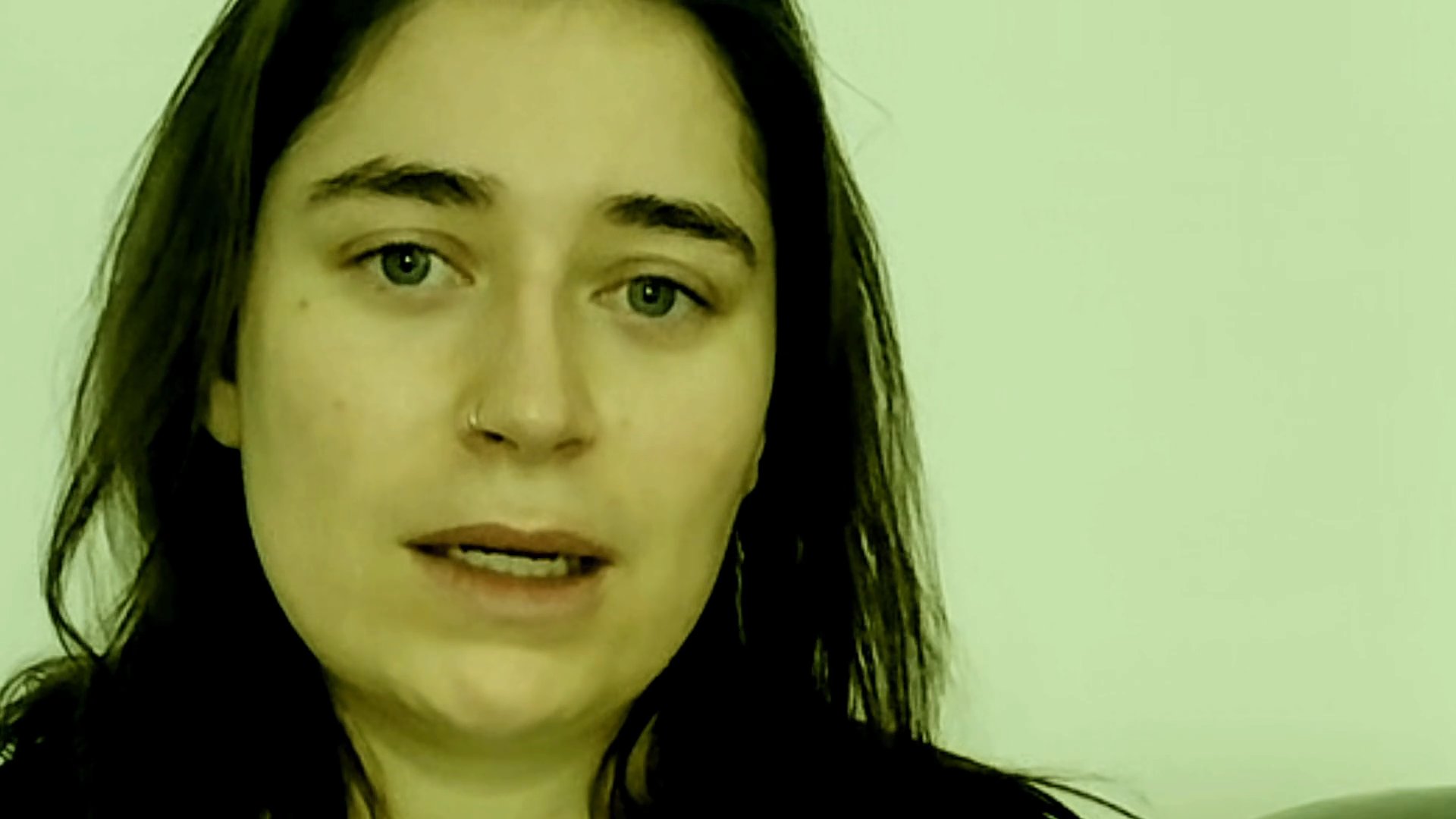 A woman delivers a direct-to-camera message, utilizing expressive facial gestures and natural speech patterns. The sequence highlights an engaging and personal communication style.
