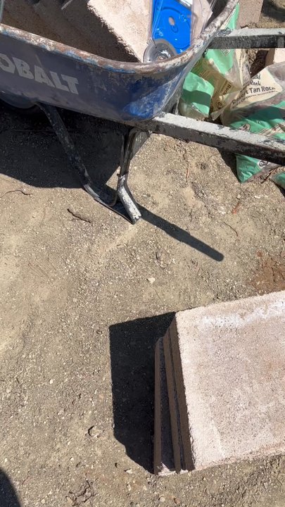Eccentric Landscape Designs - Eccentric Landscape Design building a radius Ed retain wall using Tan Orco 6 block 2 layer set w/ glided on cap. - Landscaping Near Me