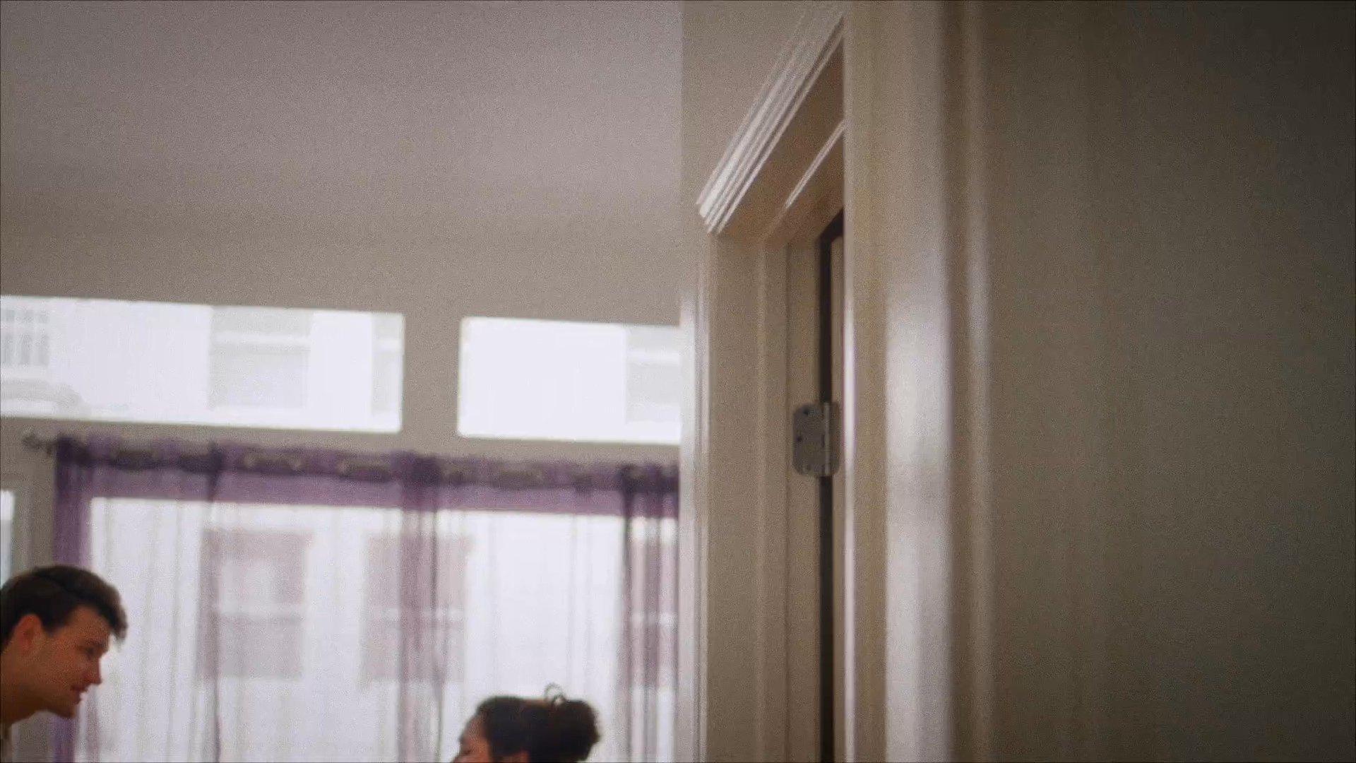 A man and a woman engage in a tense, comedic dialogue about the presence of a spider in their bathroom.