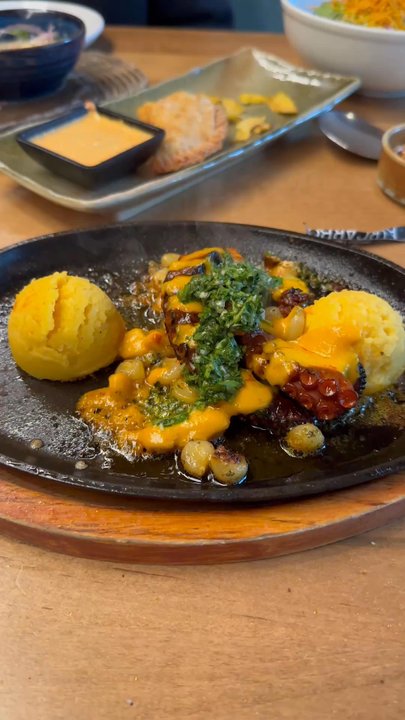 Pisco y Nazca Ceviche Gastrobar - Sizzling!!! The octopus came out sizzling and smelling amazing with some chimichurri on top.  Must try! - Peruvian Near Me - Reston, Virginia