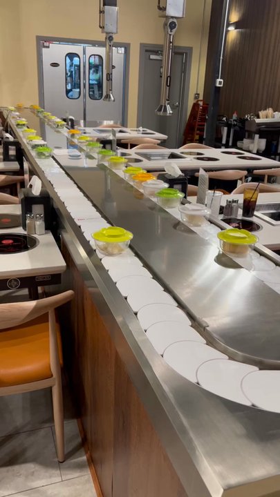 Joyspot Hotpot & Grill - Food moving throughout the tables for you to grab. - Vietnamese Near Me - Abilene, Texas