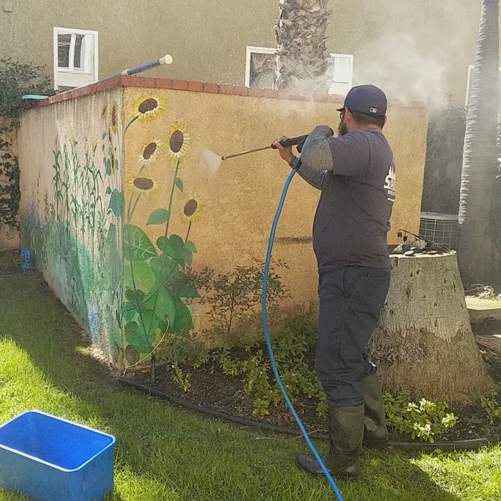 Simply Superior Window Cleaning - Pressure washing the dirt and mildew off the wall - Window Washing Near Me