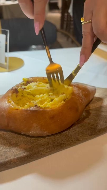 MaaMa by Cheese and Bread - They do the final step on the Adjaruli right at the table - Georgian Near Me - Norwalk, Connecticut