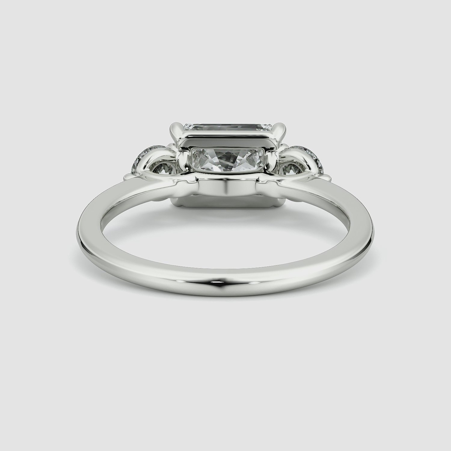 The Three Stone | Radiant | 18k | White Gold | bandAccent: Plain | diamondOrientation: horizontal | sideStoneCarat: 0.25ct | sideStoneShape: Round Brilliant | caratWeight: other