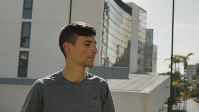 Male tennis player's reaction to winning a tennis match
