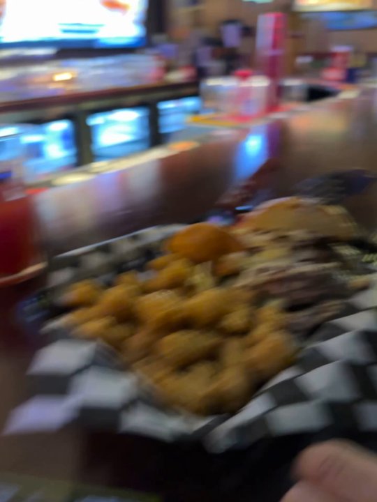 Big Sioux Burger - This is the food we received. Uncooked smash burgers. One had a stale dry bun on it. - Burgers Near Me - Sioux Falls, South Dakota