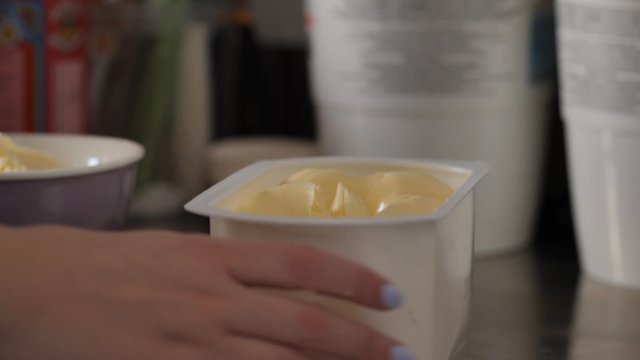 Putting butter into a bowl