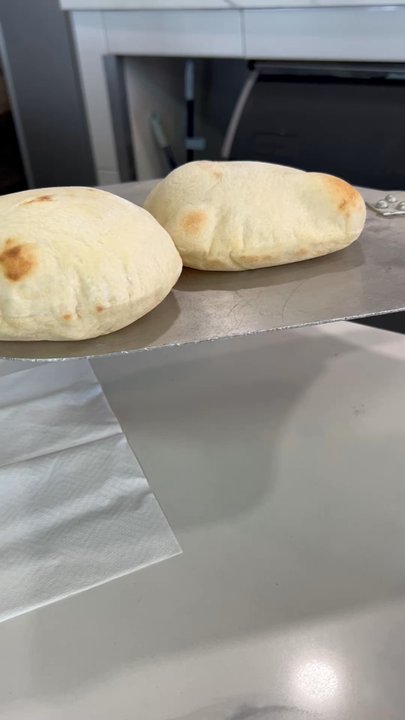 Risen Bakery & Grill - 4/28/25 Fresh made pita, Amany is so gracious to serve these HOT, we're honored - Modern European Near Me - Upland, California