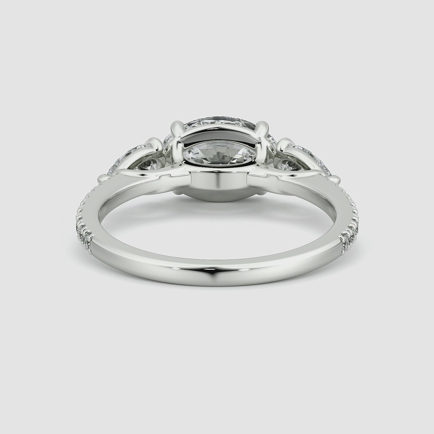 The Three Stone | Oval | 18k | White Gold | bandAccent: Pavé | diamondOrientation: horizontal | sideStoneCarat: 0.25ct | sideStoneShape: Pear | caratWeight: other