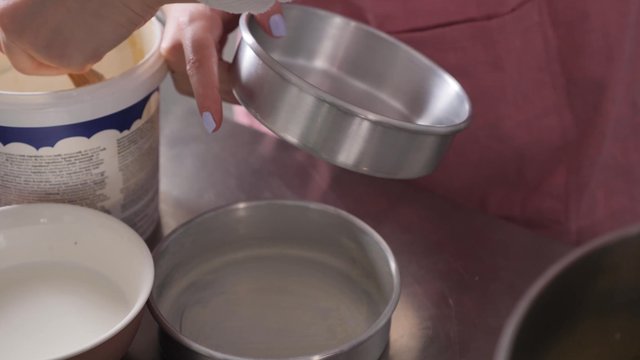 Greasing a baking dish with margarine