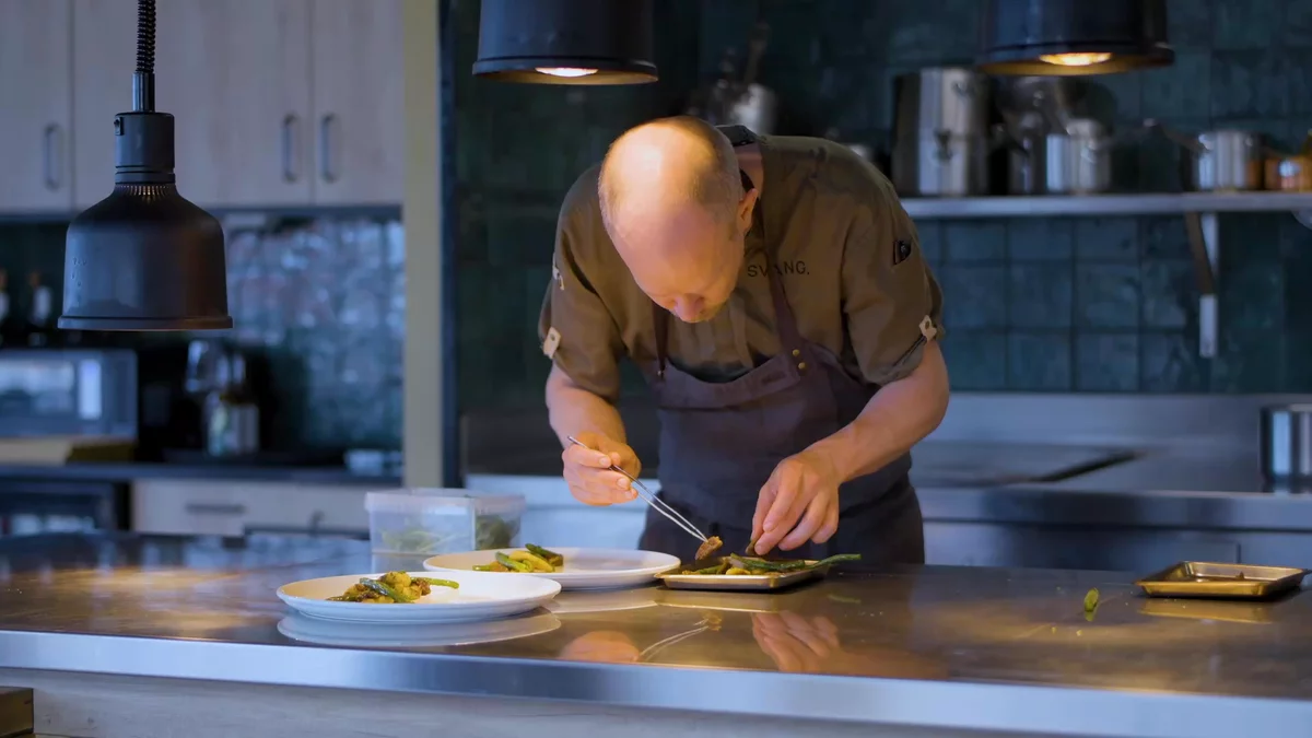A chef preparing food at Svang restaurant