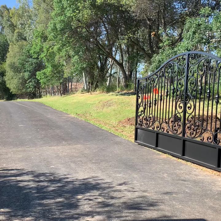 Capitol Iron - Custom swing gate powered by Liftmaster Csl24ul gate opener - General Contractors Near Me