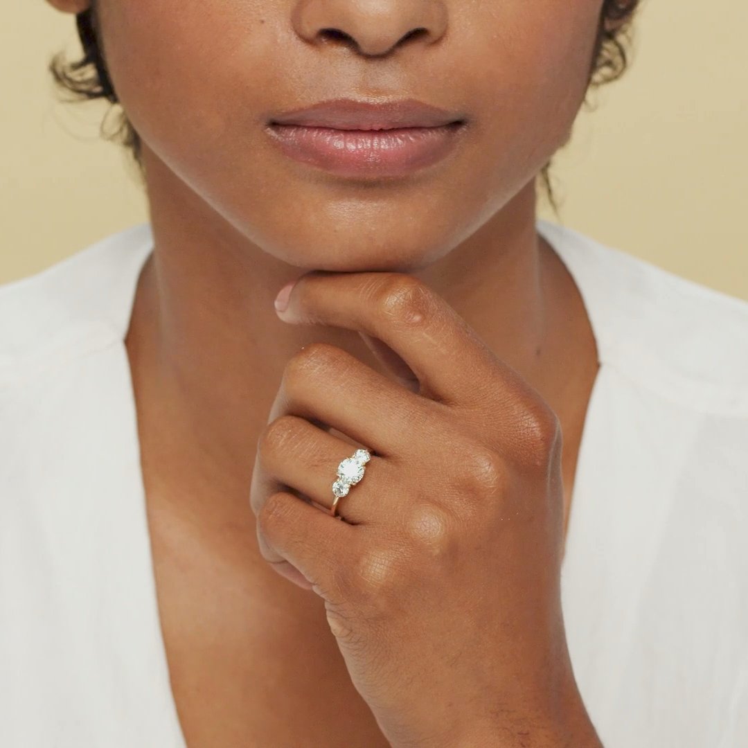 The Three Stone | Round Brilliant | 18k | Yellow Gold | bandAccent: Plain | caratWeight: other | sideStoneCarat: 0.25ct | sideStoneShape: Round Brilliant | diamondOrientation: vertical