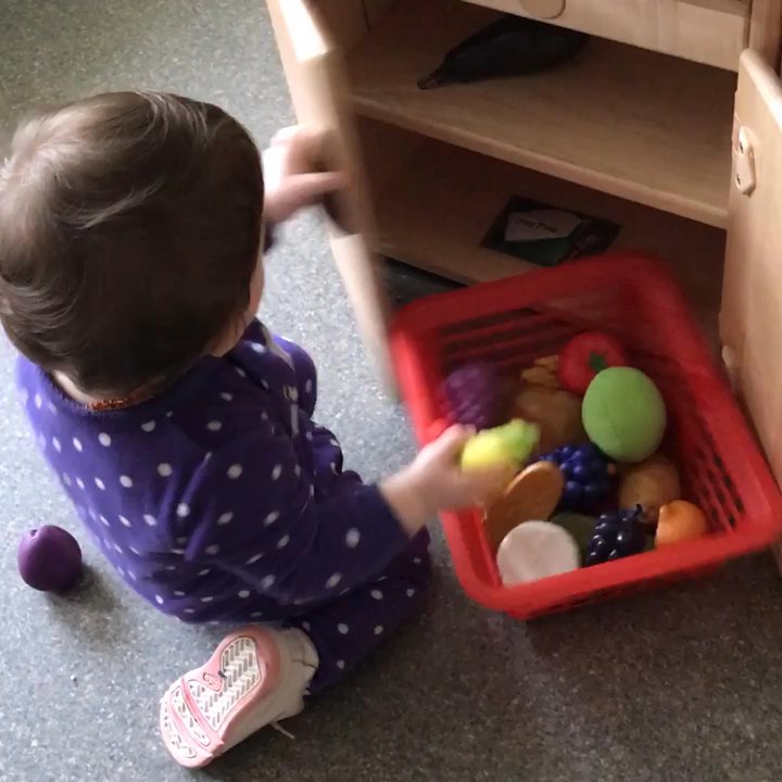 Learning Land Early Learning Program -Kent Campus - Layla playing with the food toys. - Child Care & Day Care Near Me - Kent, Washington
