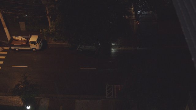 Cars driving in the rain at night