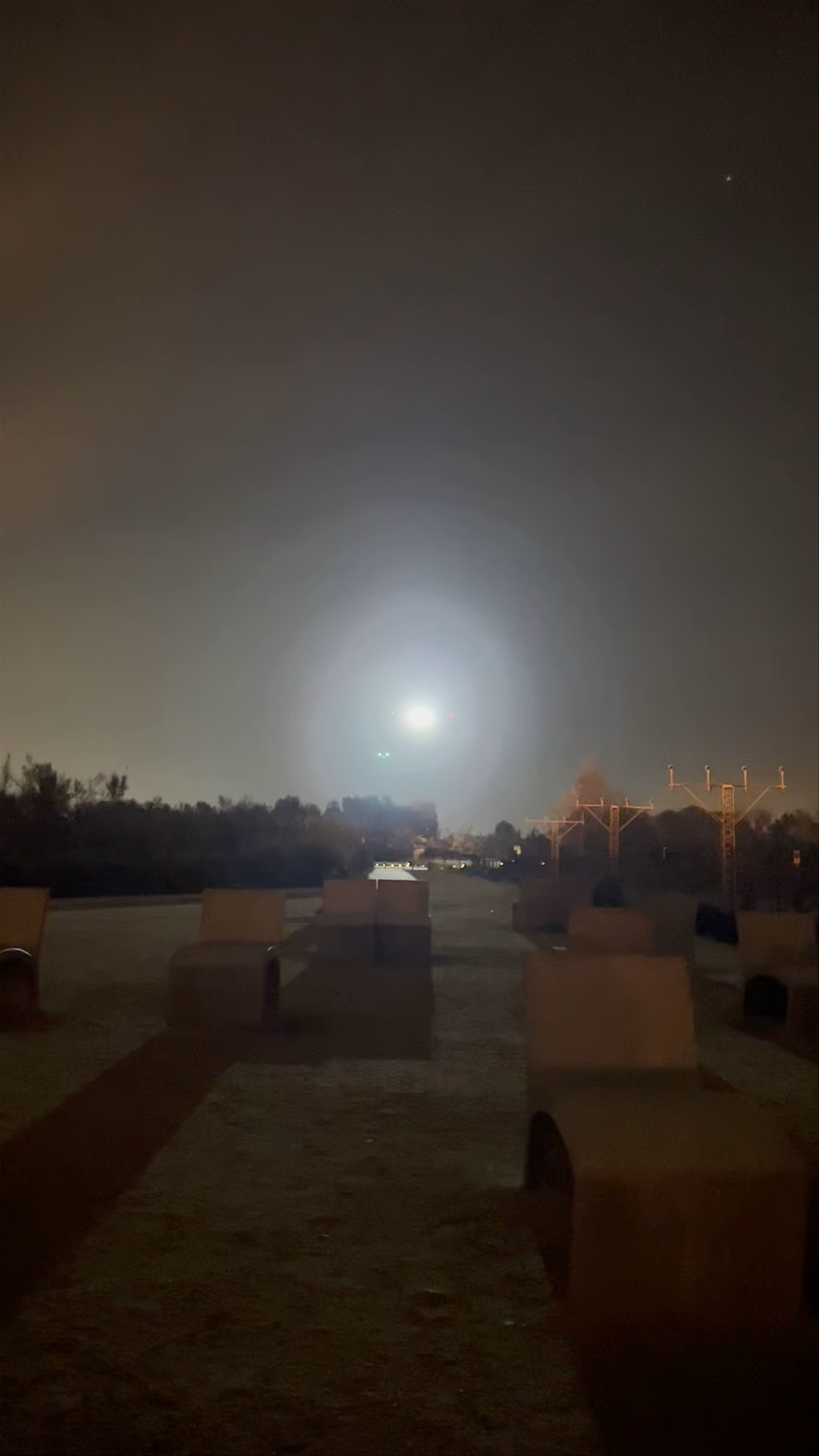 Nighttime Close-Up of Aircraft Landing at Mirador de l'Aeroport del Prat