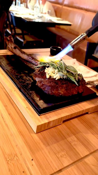 Quemar - Tableside Tomahawk American Wagyu/roasted bone marrow butter/mezcal flambee/shaved cured egg yolk/ choice of sait - Latin American Near Me - Virginia Beach, Virginia