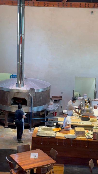 Hand Fire Pizza - Watching pizza oven Tetris - Pizza Near Me - Jackson, Wyoming