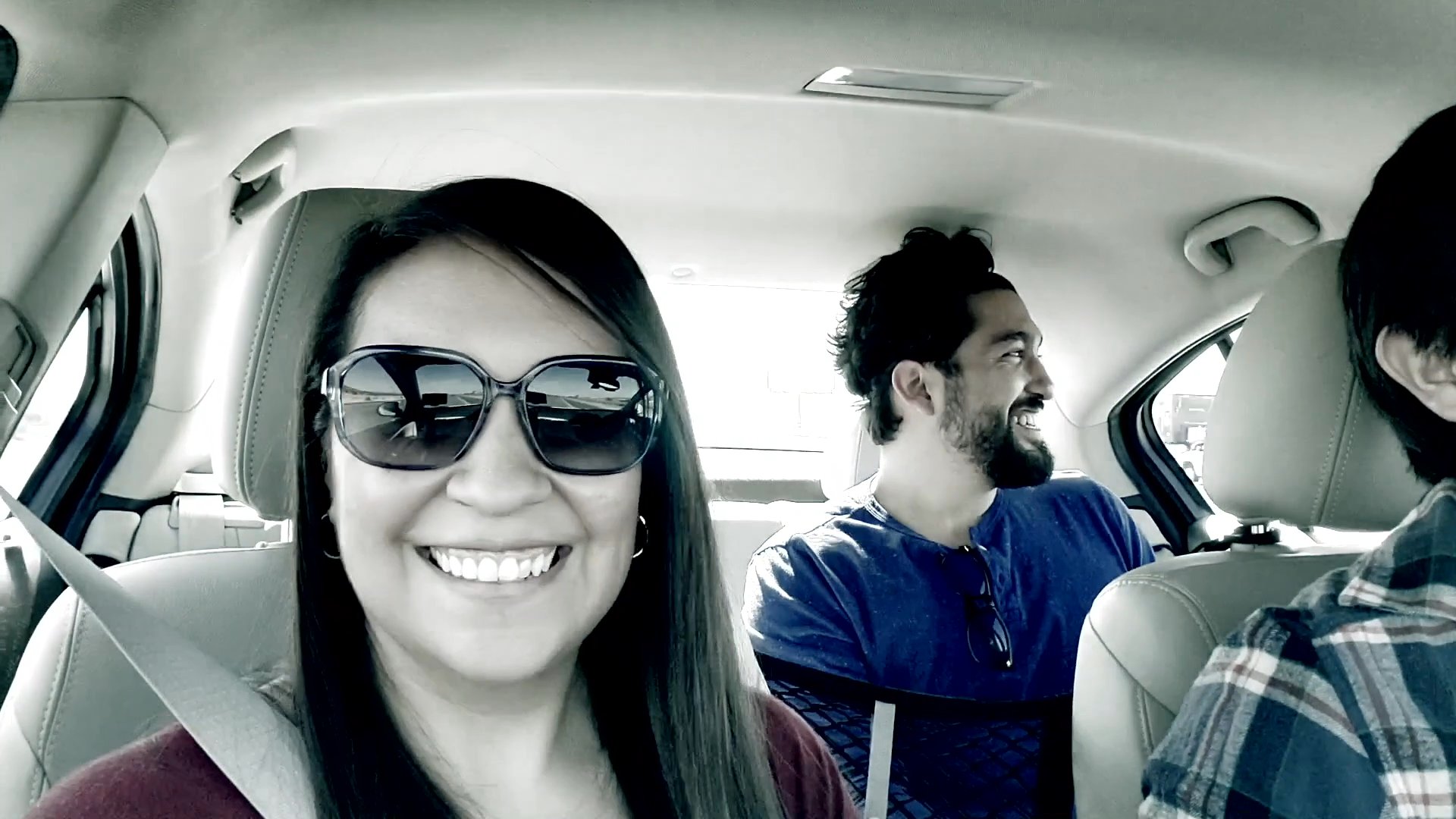 A film crew travels by car to Las Cruces, New Mexico, to conduct scheduled interviews at a secluded location.