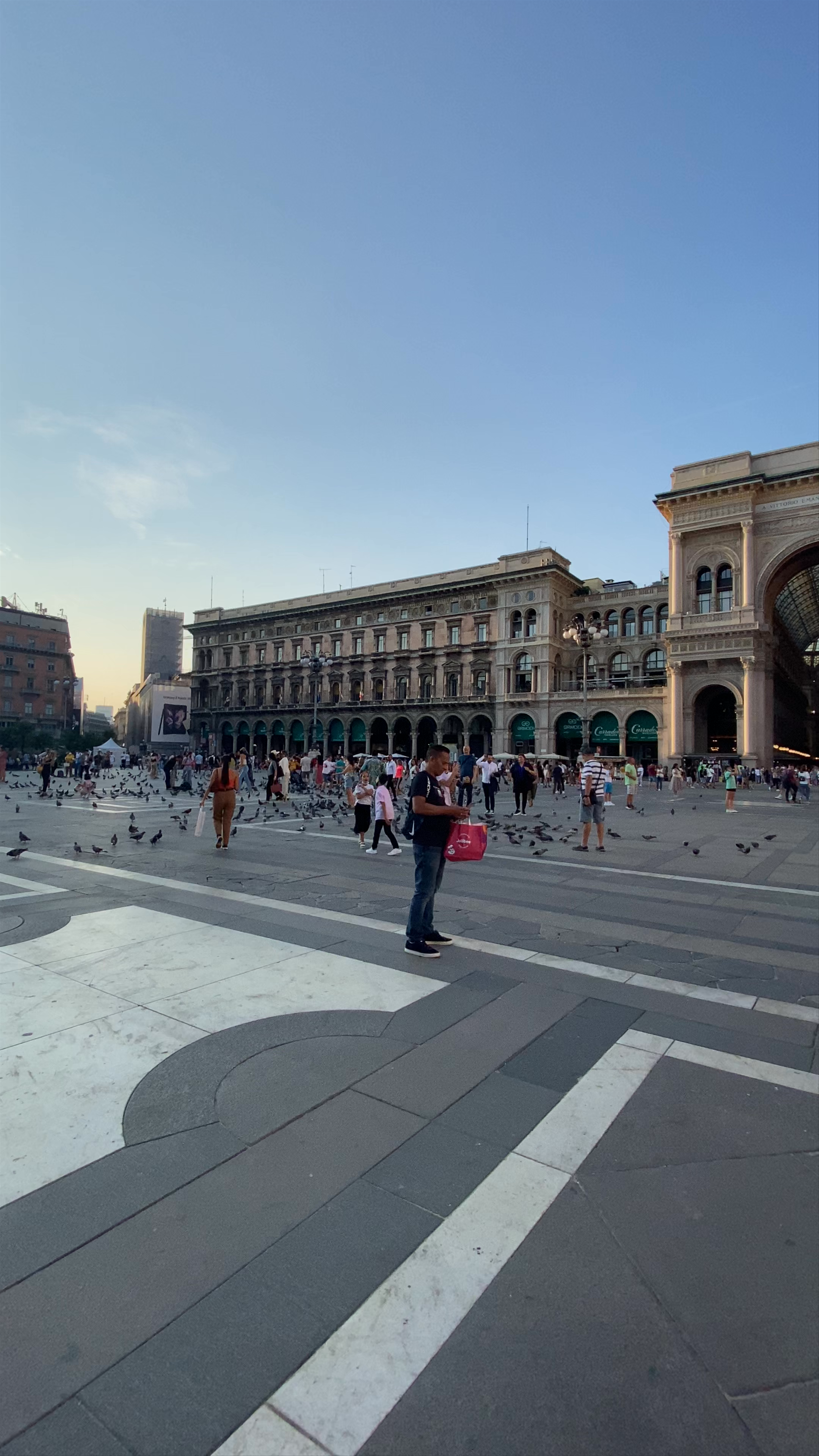 Evening at Milan's Duomo: Gothic Grandeur Meets Vibrant City Life