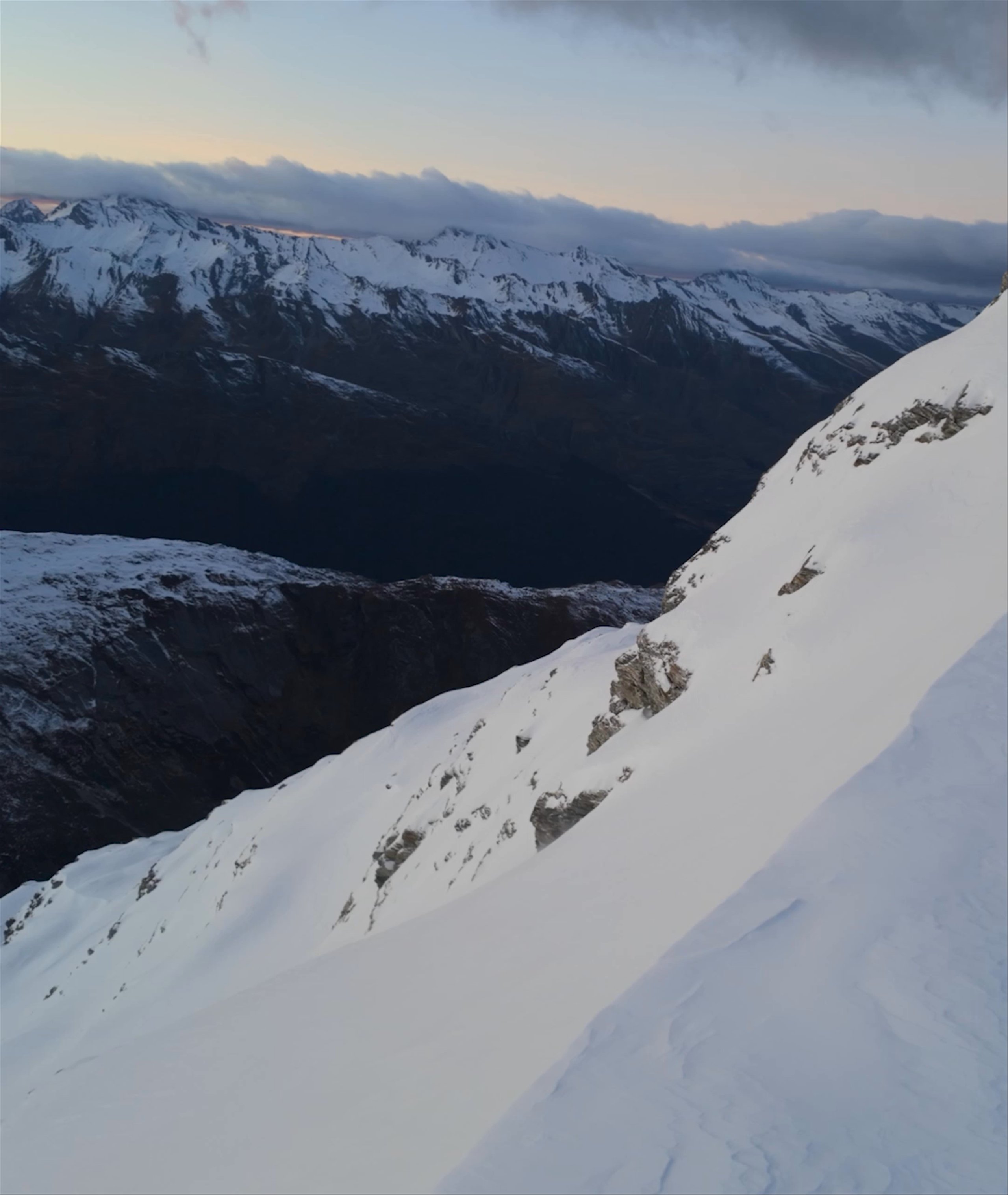 Video montage of man and woman skiing in New Zealand