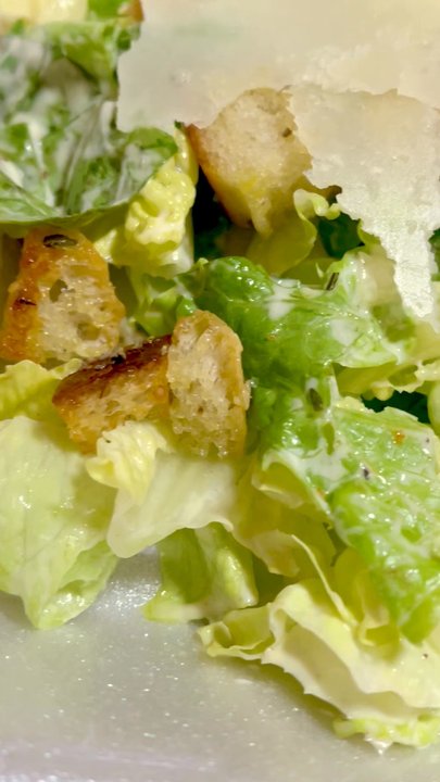 Piccolo Arancio - Caesar salad - romaine, homemade herbed croutons, tossed with Caesar dressing and topped with Parmigiano Reggiano - Italian Near Me - Farmington, Connecticut