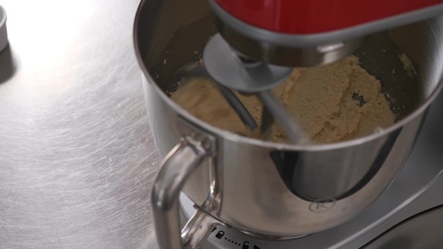 Pouring eggs into the dough