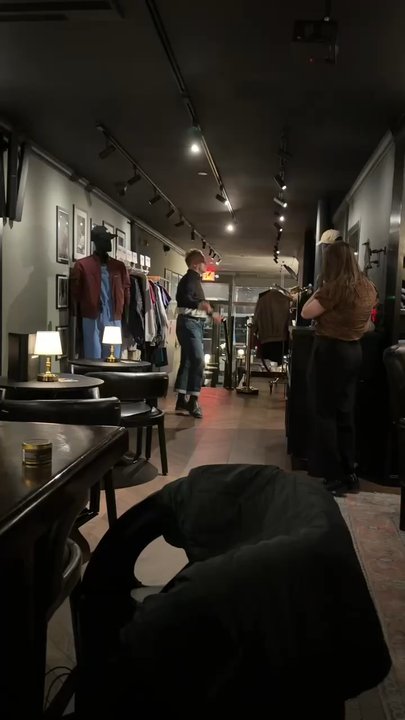 Members Only - Some guy trying on the merch - Lounges Near Me - New York, New York