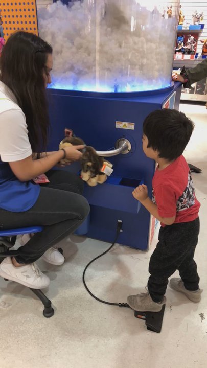Build-A-Bear Workshop - Stuffing the Animal. The kids operate it with their feet, it's really the worker who does it :) - Toy Stores Near Me - Cerritos, California