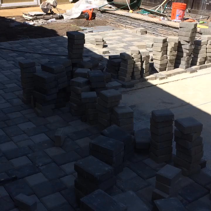 Creative Landscapes - Paver project with lawn and sprinklers when completed. - Landscaping Near Me