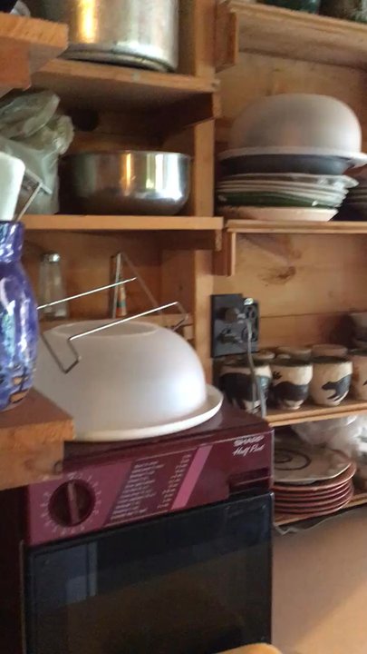 Iver Studio - Half of the art studio looks like something out of Colonial Williamsburg (less the electric stove). - Antiques Near Me - Swans Island, Maine