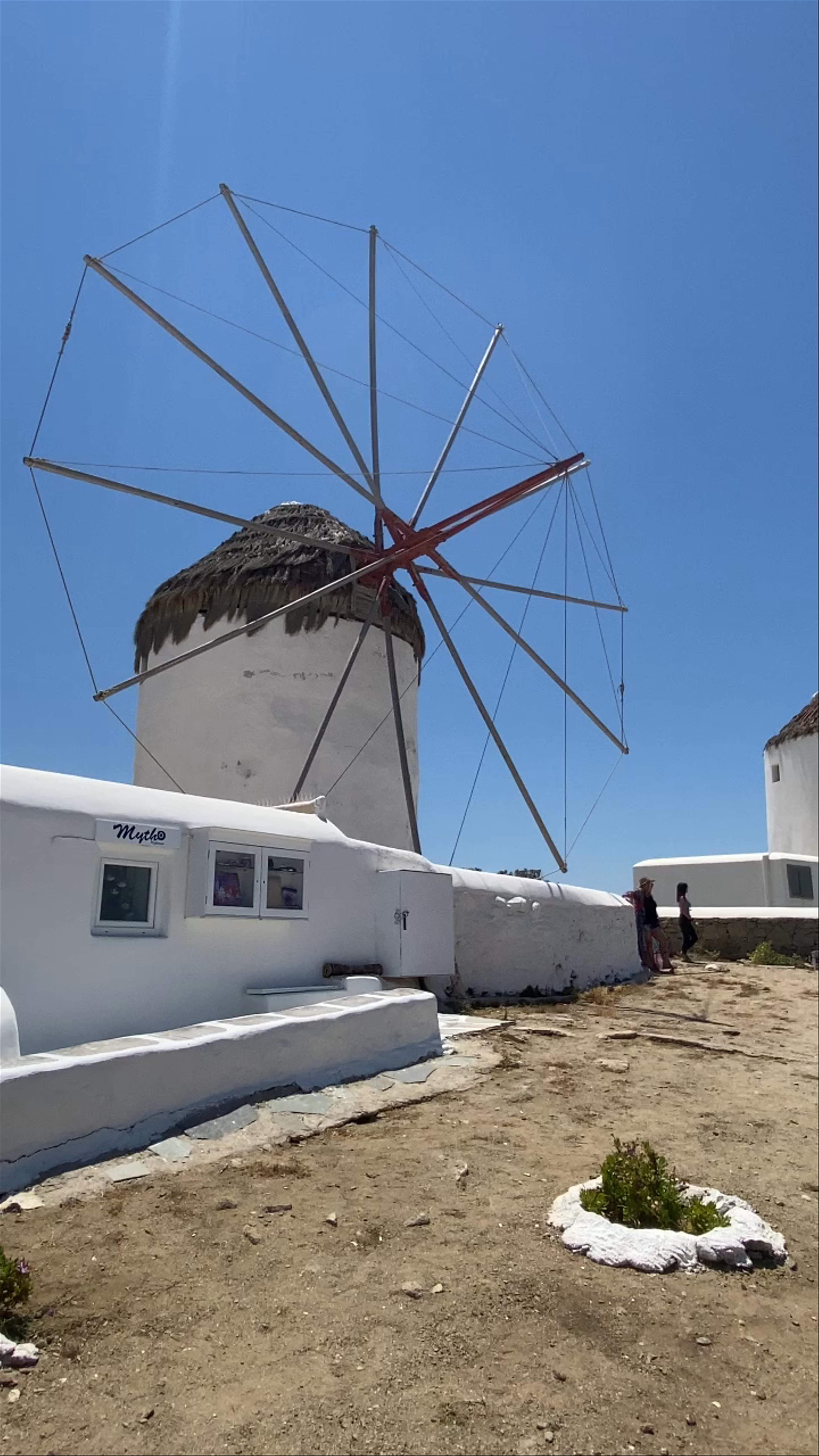 Windmills of Mykonos: Iconic White Giants by the Aegean Sea