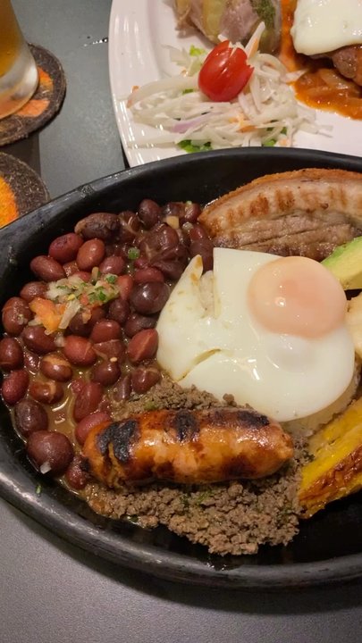 Karibik - Bandeja Paisa: Colombia's national dish  Bisteck a caballo: Argentine beef steak,fried egg, potatoes & salad - Caribbean Near Me - Aachen, NW