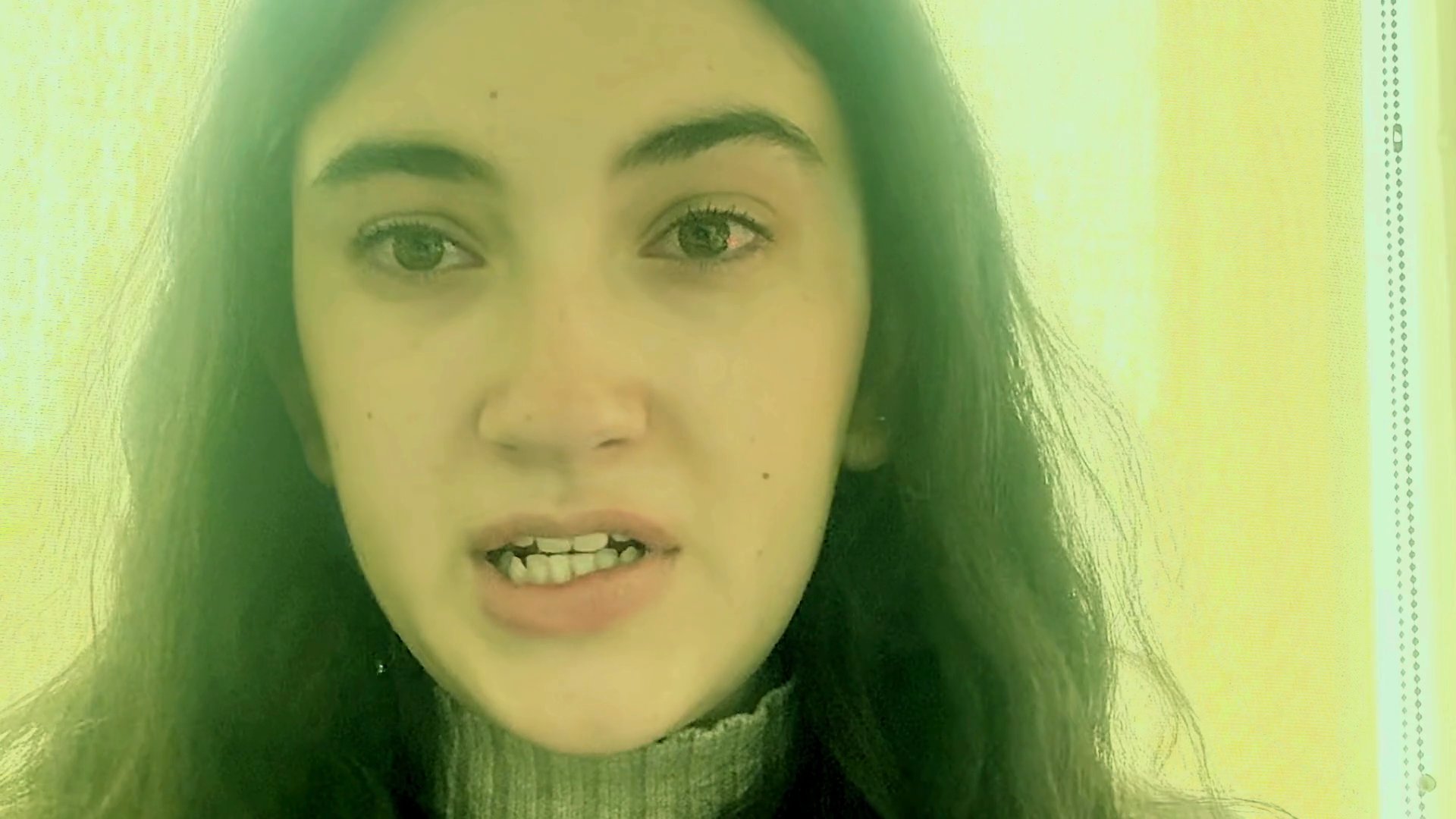 A young woman displays raw, visible signs of emotional pain and distress through facial expressions and crying. The sequence captures a shift from intense outward sobbing to a more composed but still melancholic demeanor.