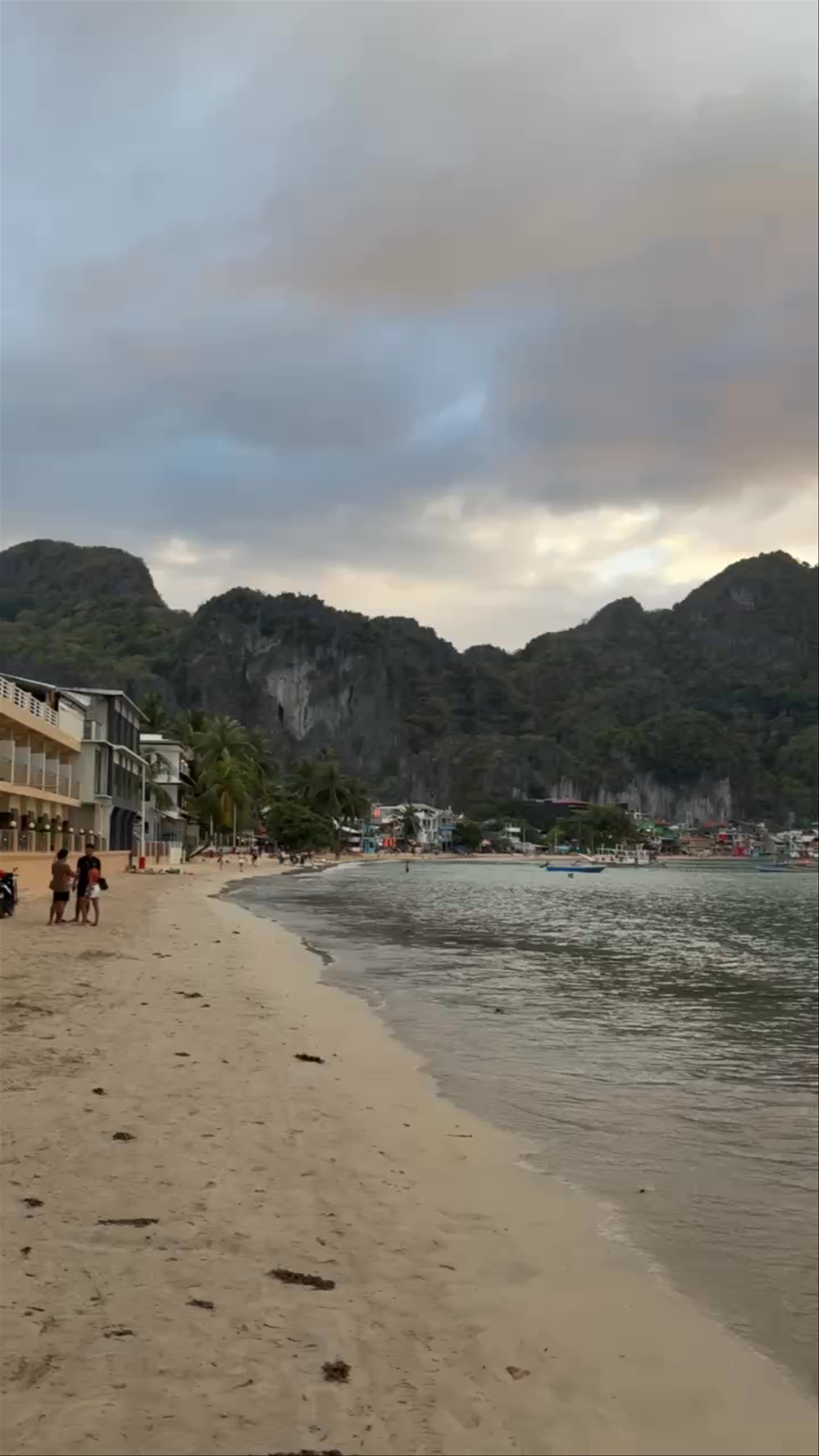 El Nido Beach Evening Calm: Serene Shores and Majestic Limestone Hills