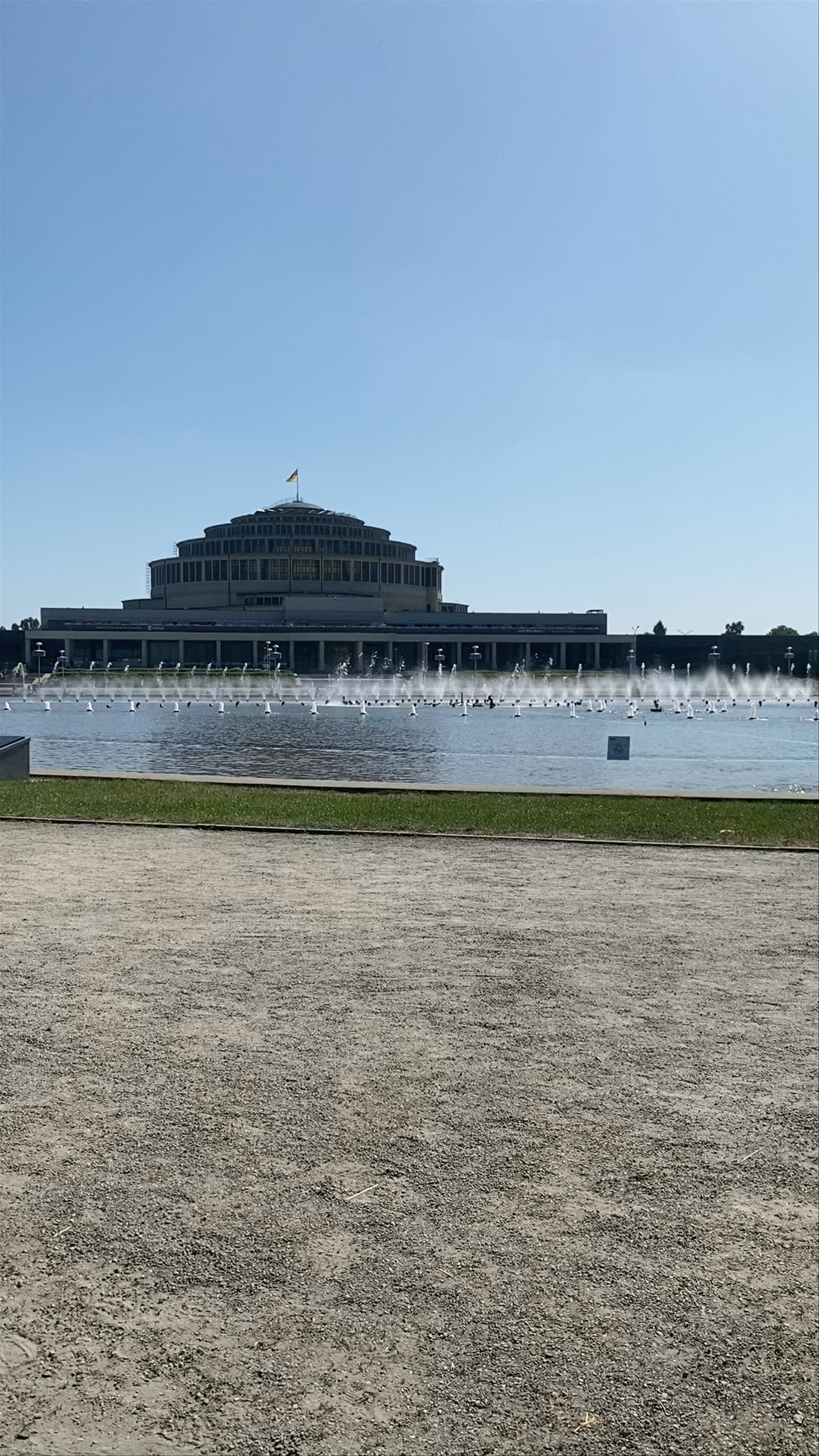 Hala Stulecia Fountain Show - Majestic Architecture and Sparkling Water Display in Wrocław