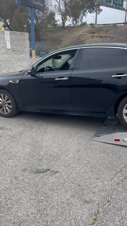 Fernando Towing - Vehicle being put on the flat bed tow truck - Towing Near Me - Los Angeles, California