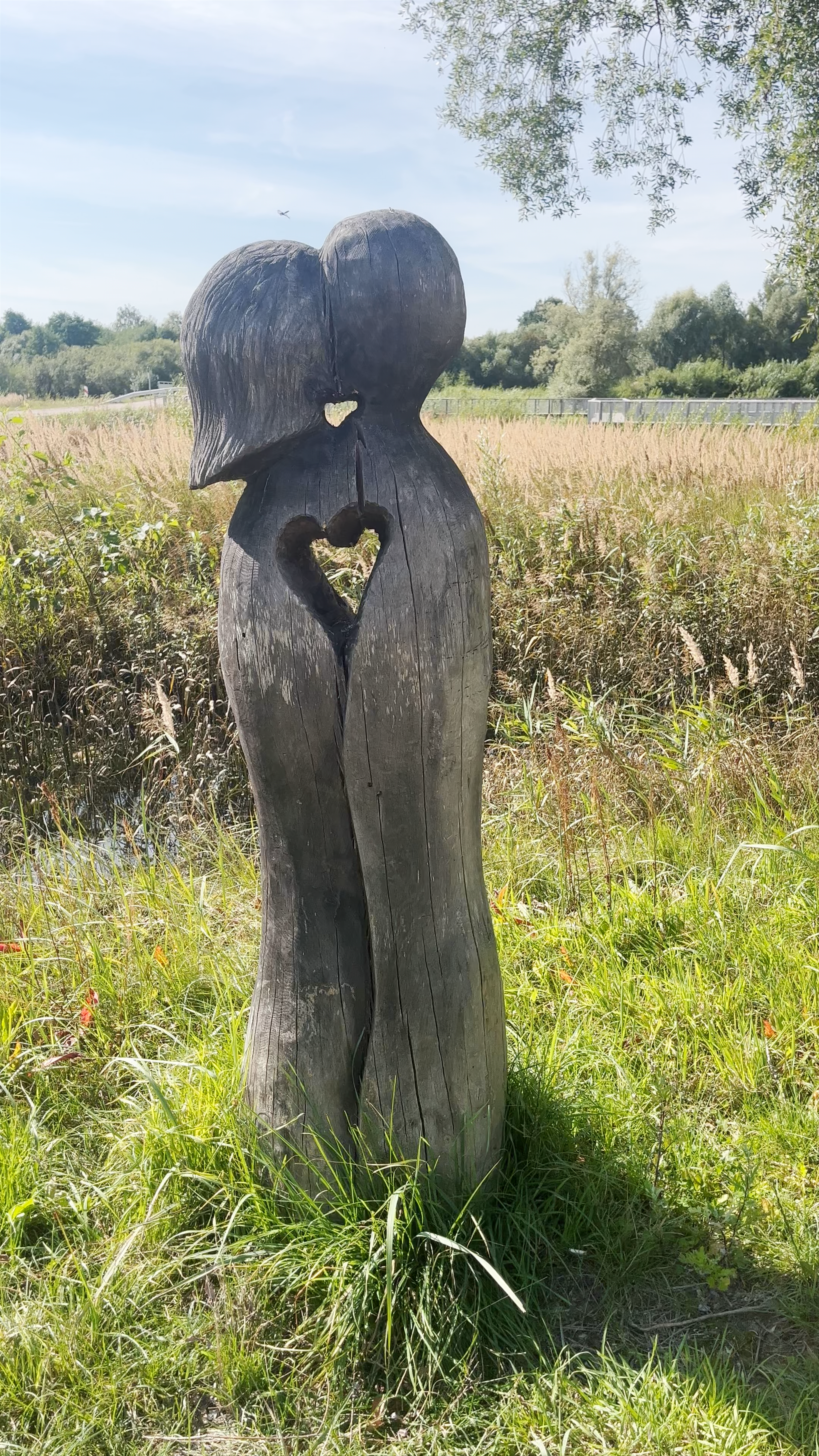 Wooden Sculpture of Lovers with Heart Cutout by the Svēte River Meadows, Jelgava, Latvia