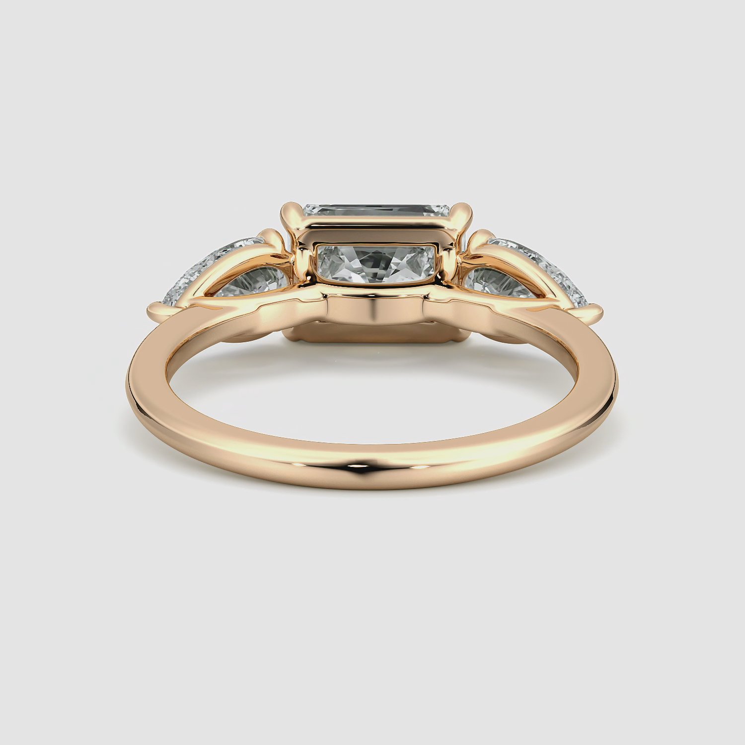 The Three Stone | Radiant | 14k | Rose Gold | bandAccent: Plain | diamondOrientation: horizontal | sideStoneCarat: 0.50ct | sideStoneShape: Pear | caratWeight: other